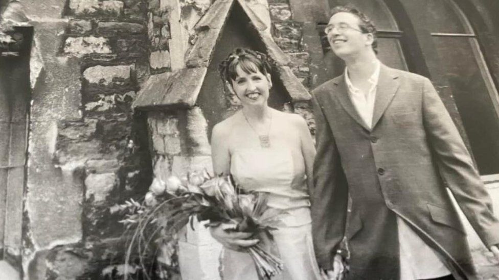 Tracey Close and Dr Daryl Dugdale in a b&w photo of their wedding day
