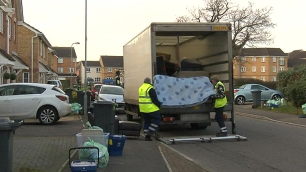 Photo of Cardiff council staff collecting an old mattress