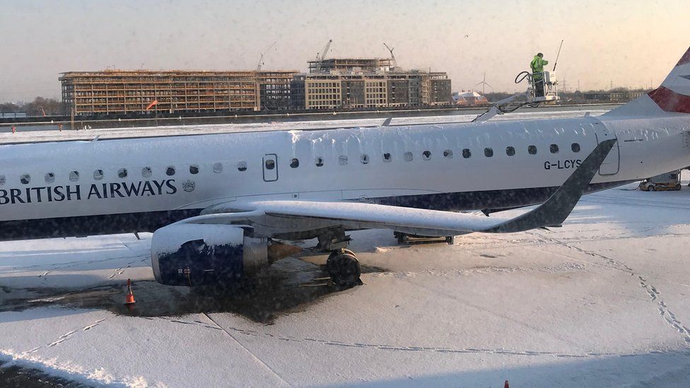 A smattering of snow on the runway at City Airport had caused eight flight cancellations by 9:00 GMT