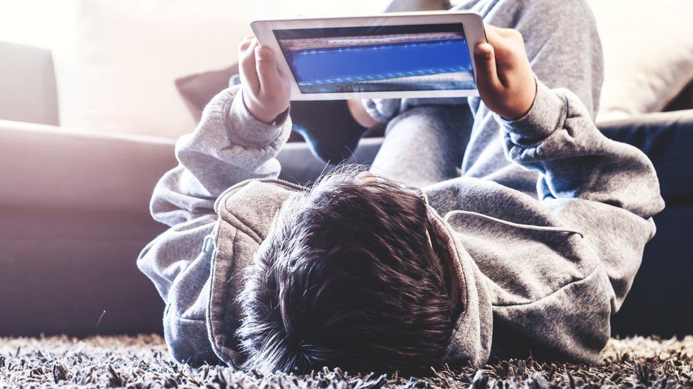 Teen using a tablet computer