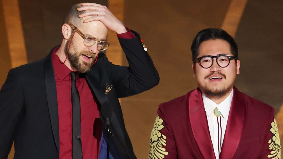 Daniel Scheinert and Daniel Kwan accept the award for Directing at the 95th Academy Awards in the Dolby Theatre on March 12, 2023 in Hollywood, California