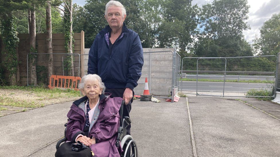 Tony Brooks and his 90-year-old mother Margaret whom is in a wheelchair stood on the street