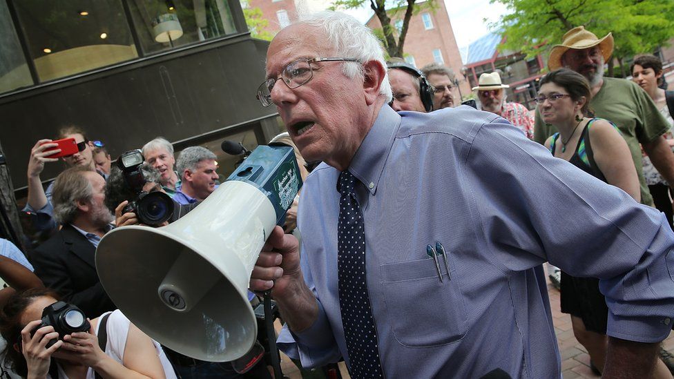 Sanders speaks to supporters through a bullhorn