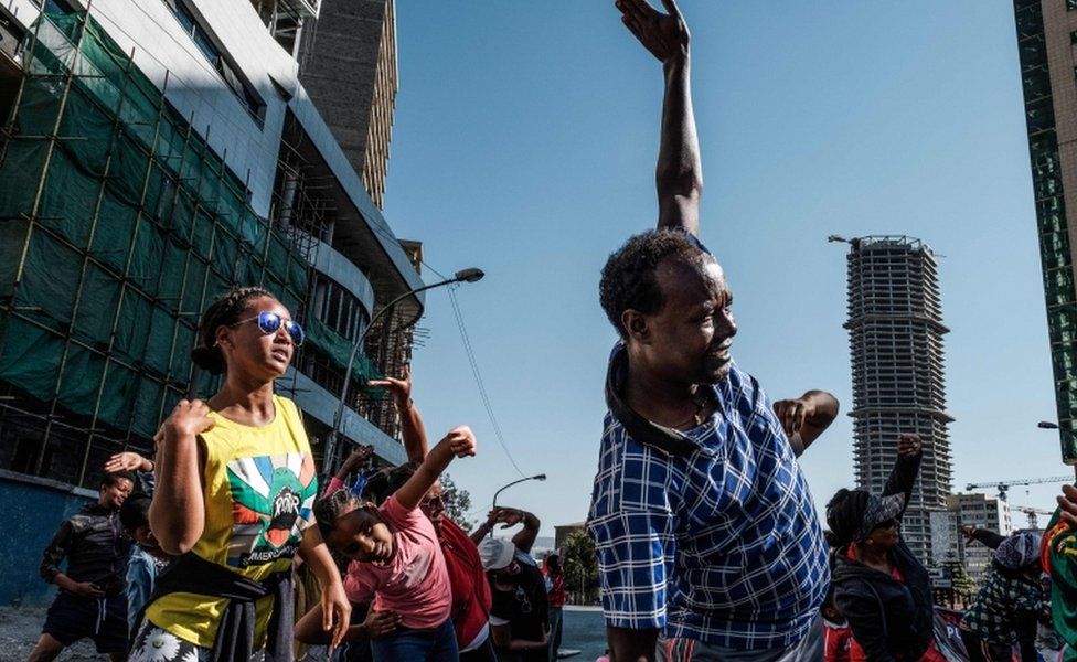 People take part in an exercise on a street in Addis Ababa on Car Free Day, 3 February
