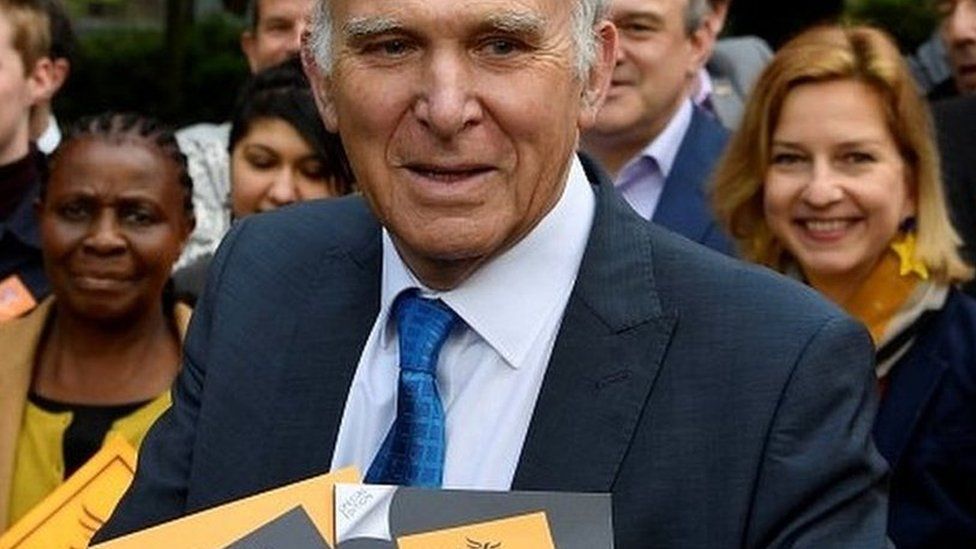 Sir Vince Cable holds the party's European election manifesto at a campaign event in May
