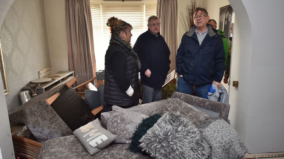 First Minister Mark Drakeford visits a flood-affected house in Nantgarw