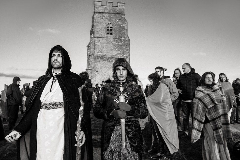 People celebrate a pagan festival dressed in mediaeval clothing