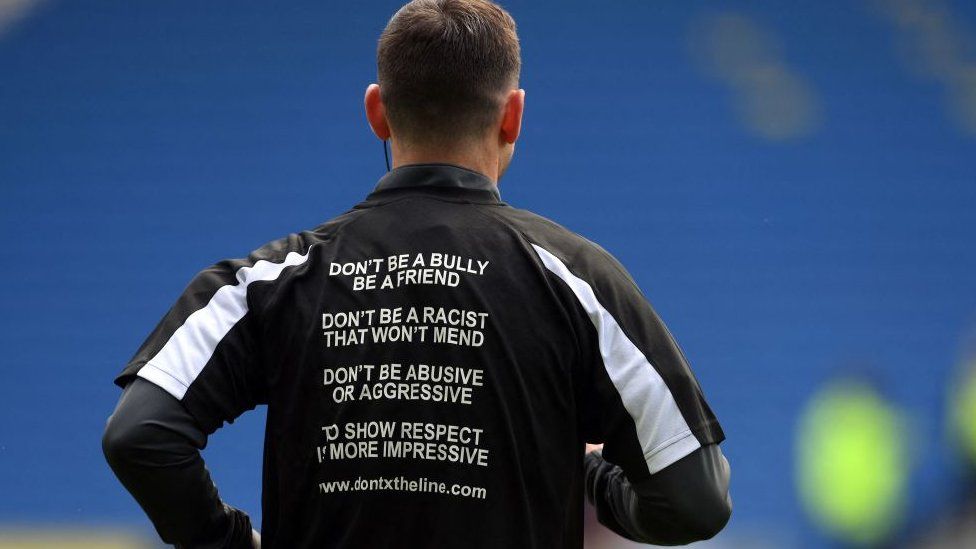 Match officials at an England Premier League game last month wore T shirts bearing anti-abuse slogans.