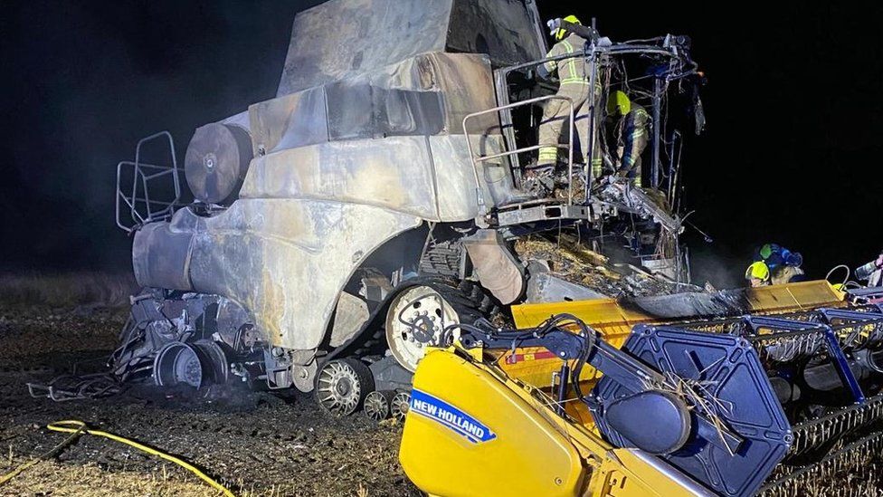 Close up of burnt out combine harvester.