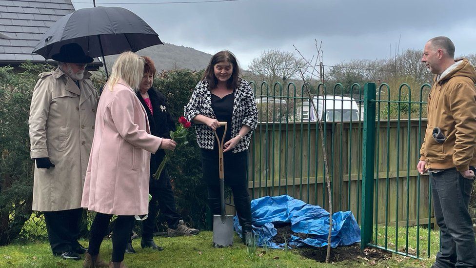 Sioned Williams and Gleision family members planting a tree to remember the four men who died in the mining disaster