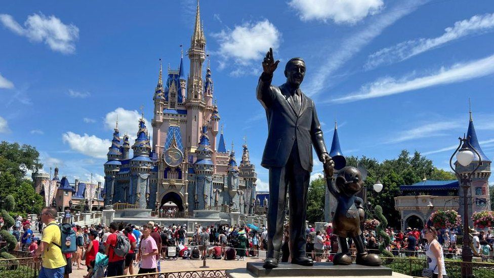 People gather at the Magic Kingdom theme park at Walt Disney World in Florida, USA on 30 July 2022
