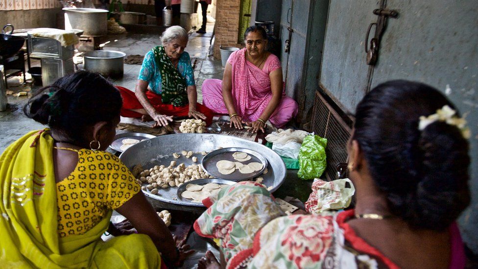 Women making food for a wedding in Mumbai