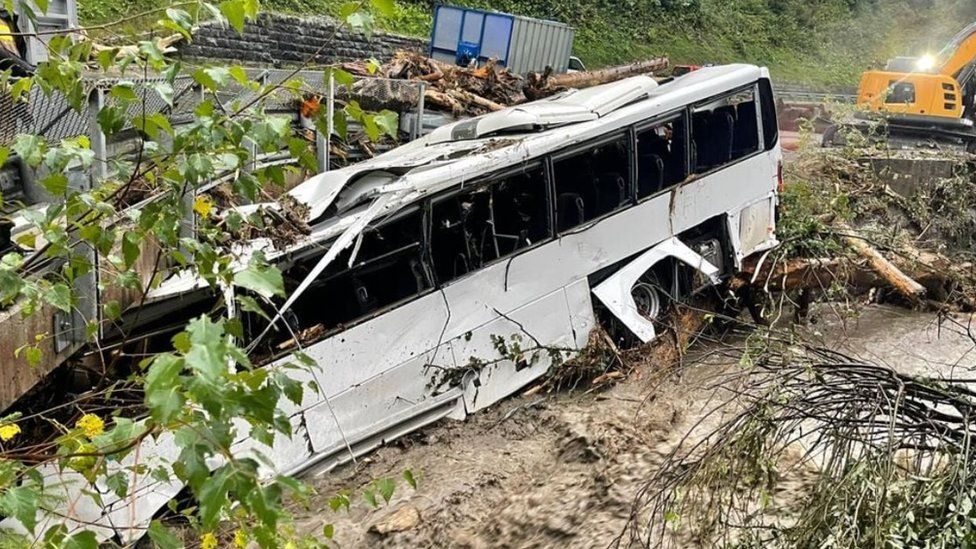 Only a few people were on the bus when it was caught up in flooding at Dienten