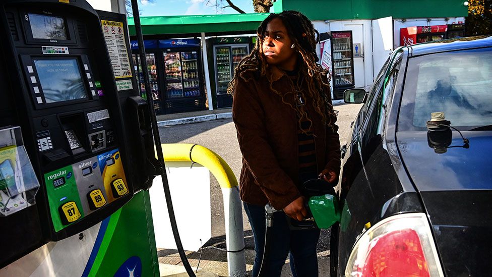 Woman at petrol pump