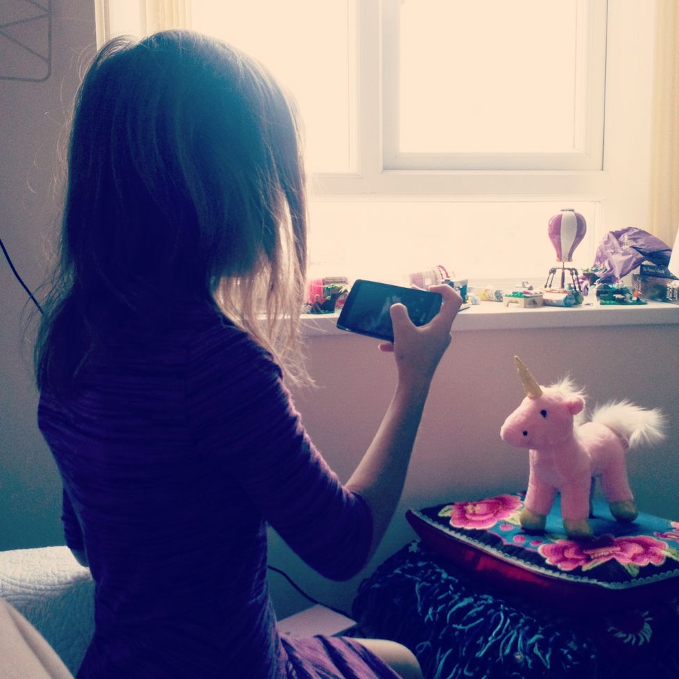 Tracy's daughter takes a picture of a pink unicorn