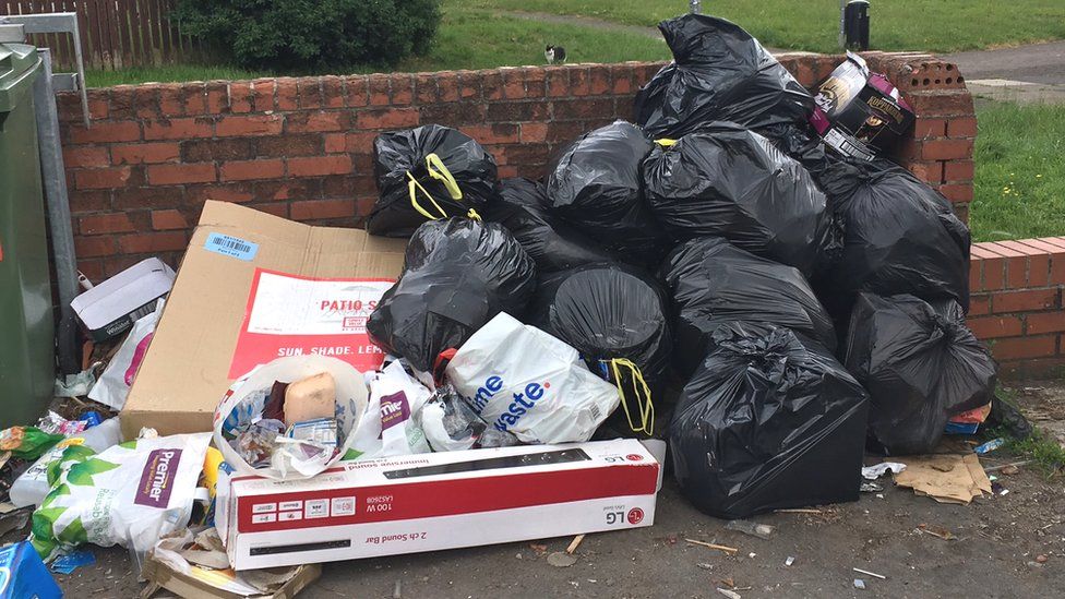 Rubbish dumped by bins on the Wildmill estate in Bridgend