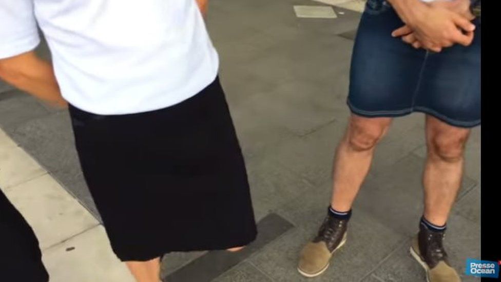 Men wearing skirts in protest
