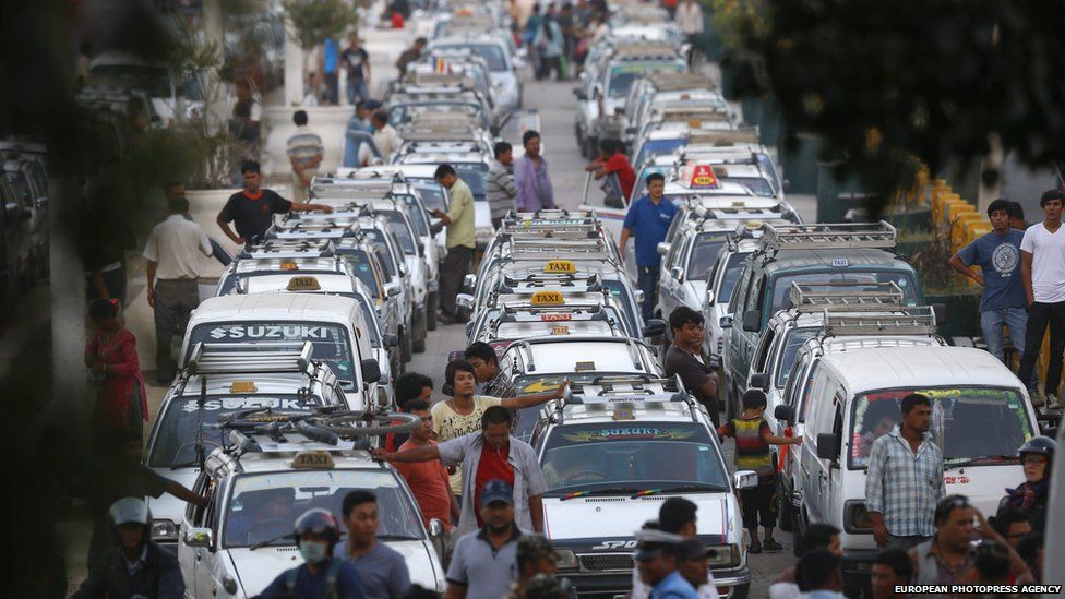A line of taxis as drivers wait for fuel at a petrol station in Kathmandu