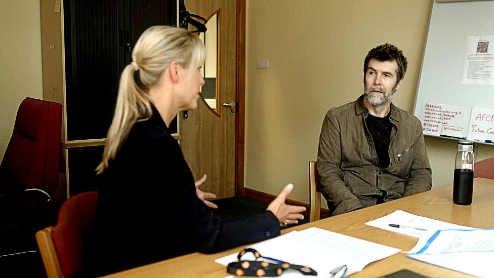 Prof Mererid Evans with Rhod Gilbert in her consulting room