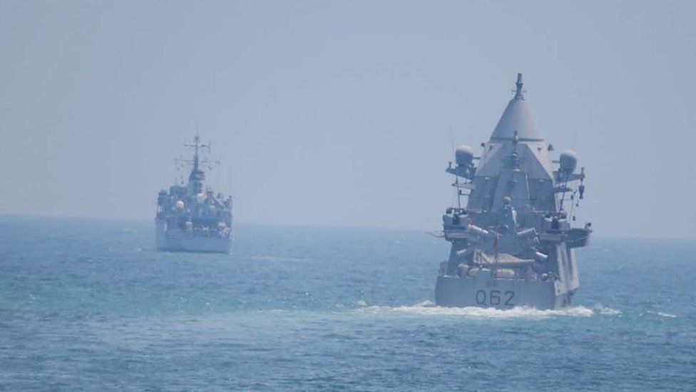 Two warships near one another at sea
