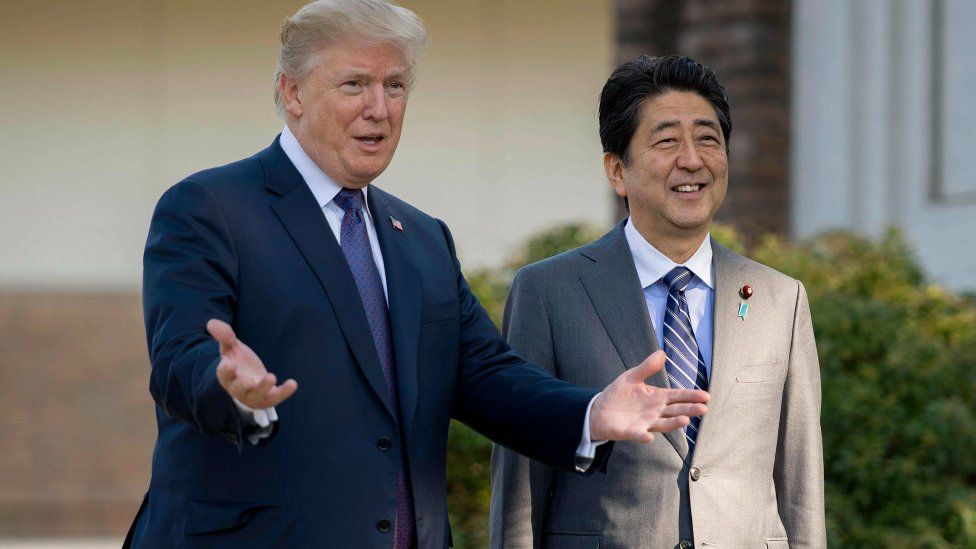 President Donald Trump with Japan's Prime Minister Shinzo Abe at the Kasumigaseki Country Club Gold Course in Tokyo on 5 November 2017