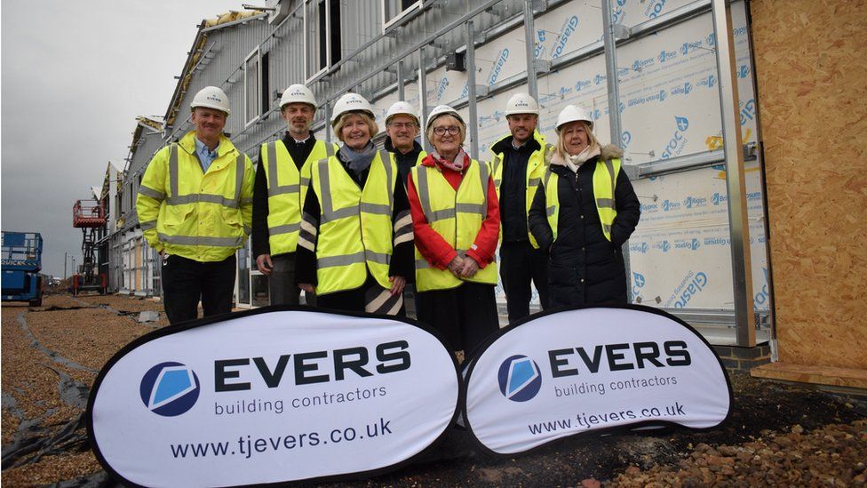 Essex councillors Lesley Wagland and Mary Newton in Jaywick Sands with council officers and construction workers