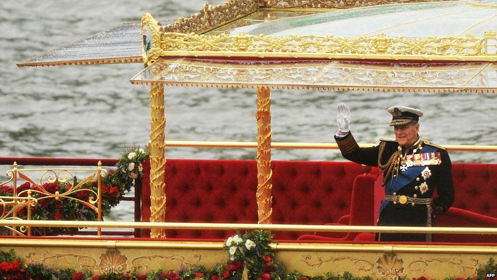 Prince Philip, Duke of Edinburgh, waves as he stand onboard the Spirit of Chartwell during the Thames Diamond Jubilee Pageant