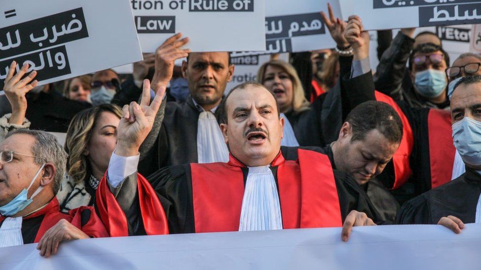 The president of the Association of Tunisian Judges, Anas Hmaidi wearing judicial robe, shouts slogans during a demonstration in Tunis, Tunisia, on February 10, 2022,