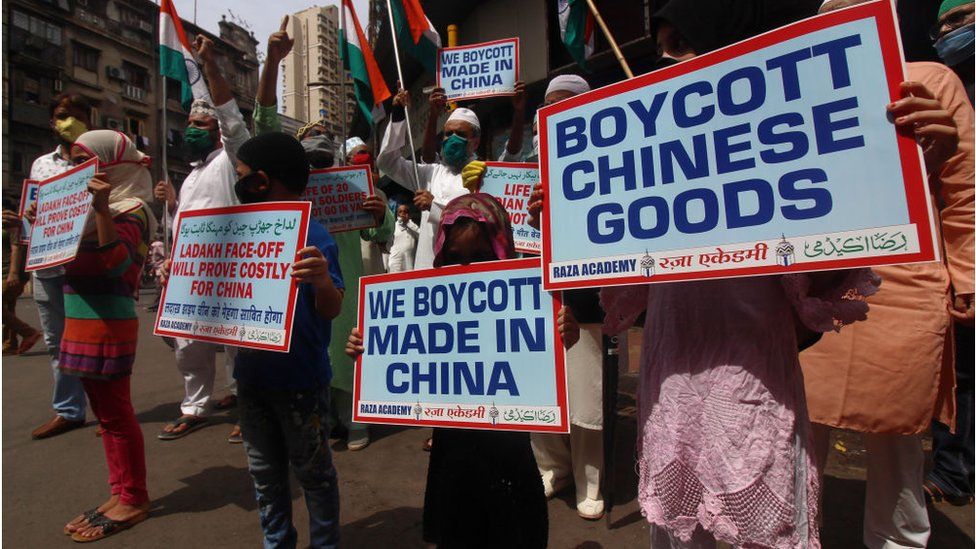 Activists hold placards and shout slogans against China during a protest in Mumbai, India on June 20, 2020.