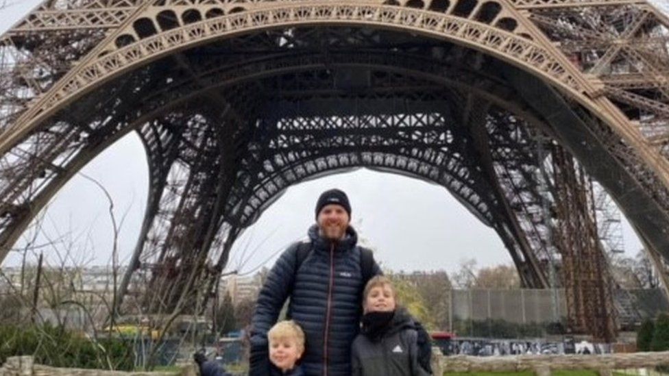 Damien with this two boys at the Eiffel Tower