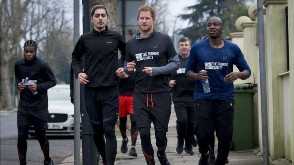 Prince Harry jogs with volunteers and young homeless people from The Running Charity