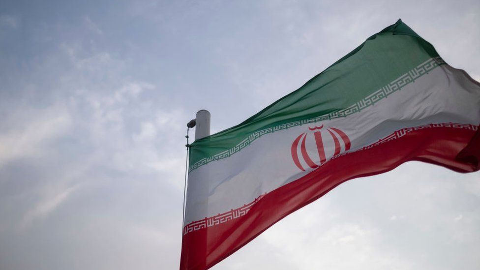 An Iran flag waves at the Imam Khomeini grand mosque in downtown Tehran