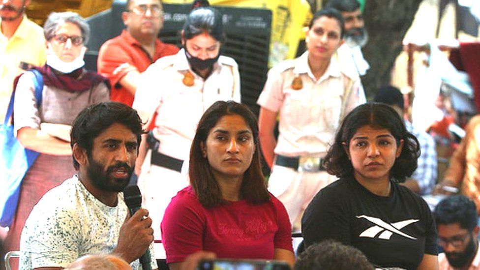 Wrestlers Sakshi Malik, Vinesh Phogat, Bajrang Punia during the ongoing protest against WFI Chief Brij Bhushan, at Jantar Mantar, on May 20, 2023 in New Delhi, India. (Photo by Salman Ali/Hindustan Times via Getty Images)