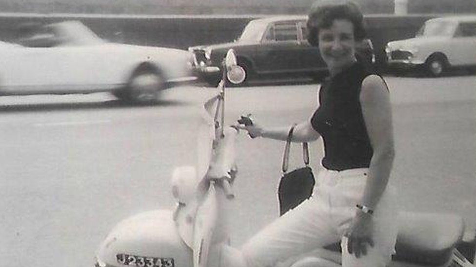Doris Cleife as a young woman with a moped