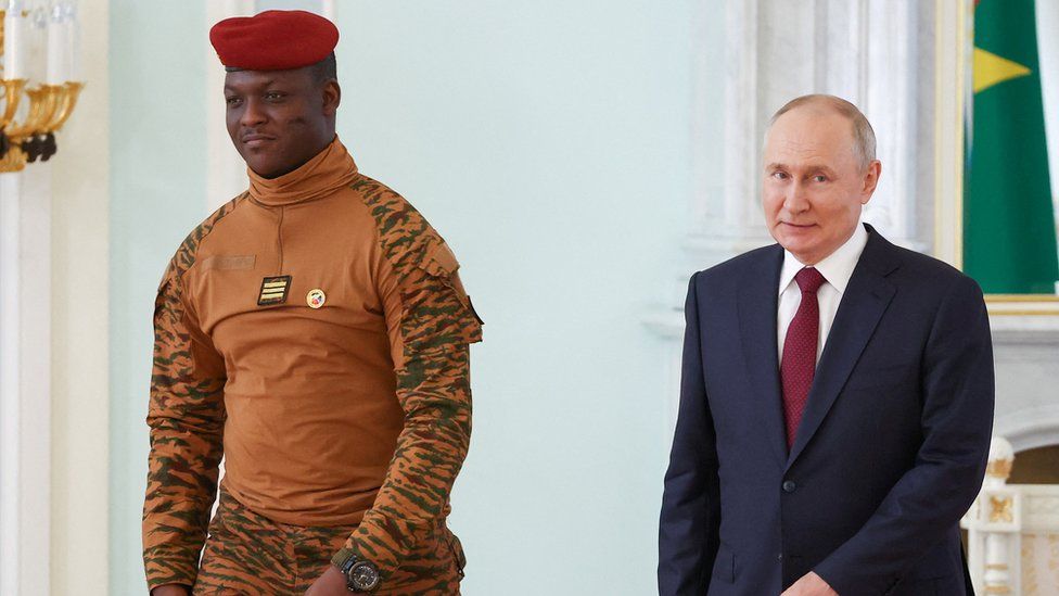 Burkina Faso's interim President Ibrahim Traore meeting Russia's president Vladimir Putin walking