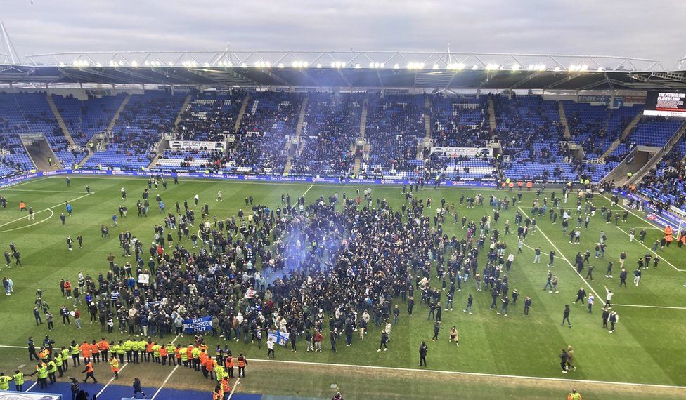 Reading fans invade the pitch