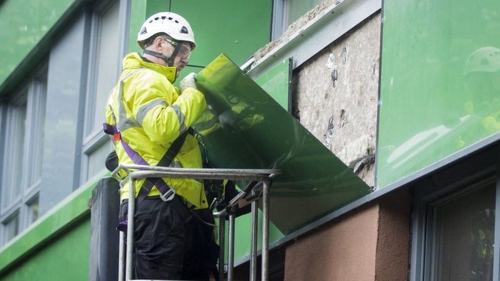 Cladding being removed from a tower block in Sheffield in 2017
