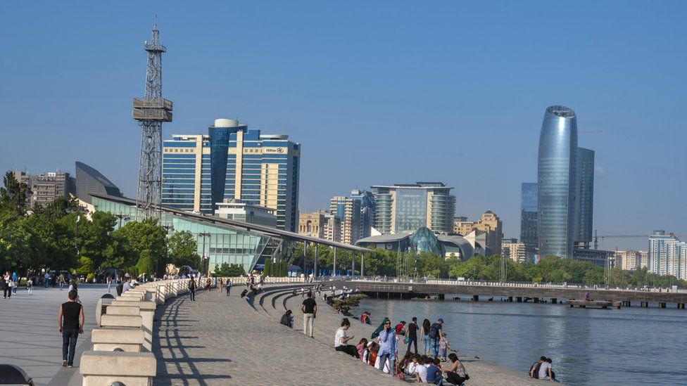 People sitting and relaxing on the shores of the Caspian Sea in Baku