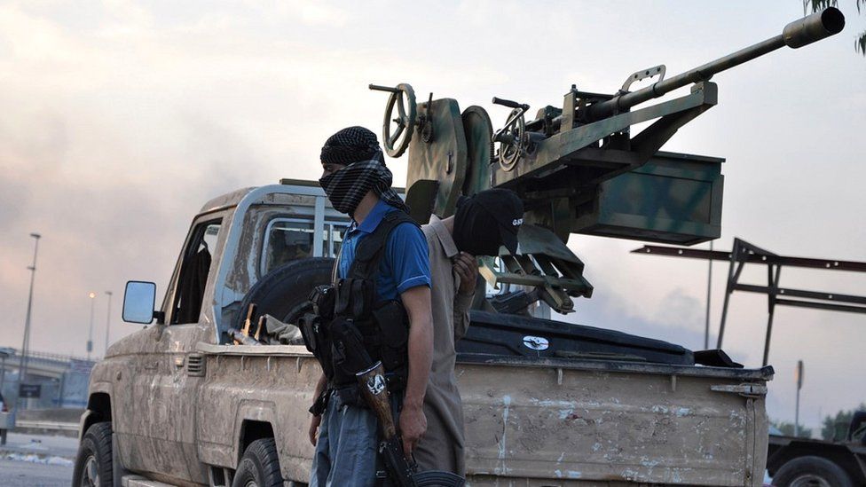 IS fighters in Mosul, 12 Jun 14