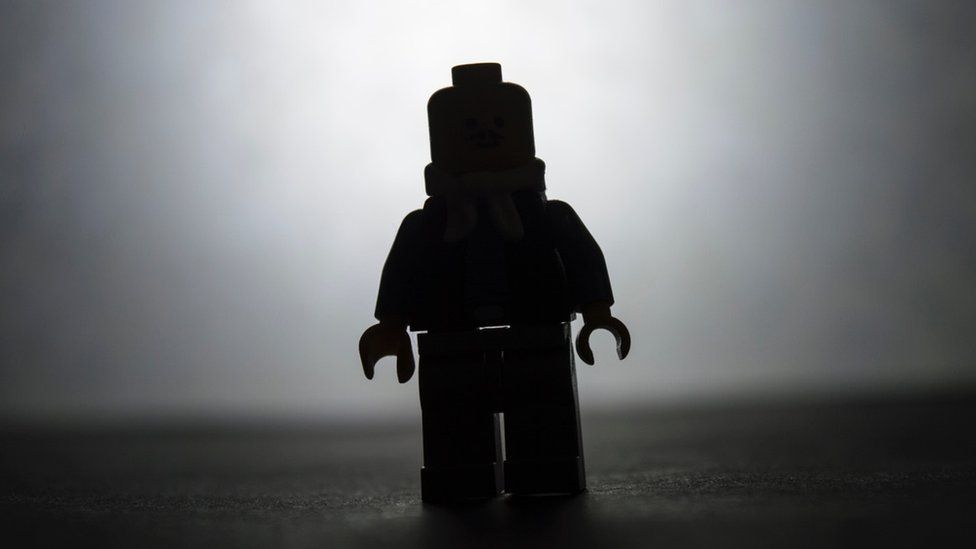 Lego figure in silhouette