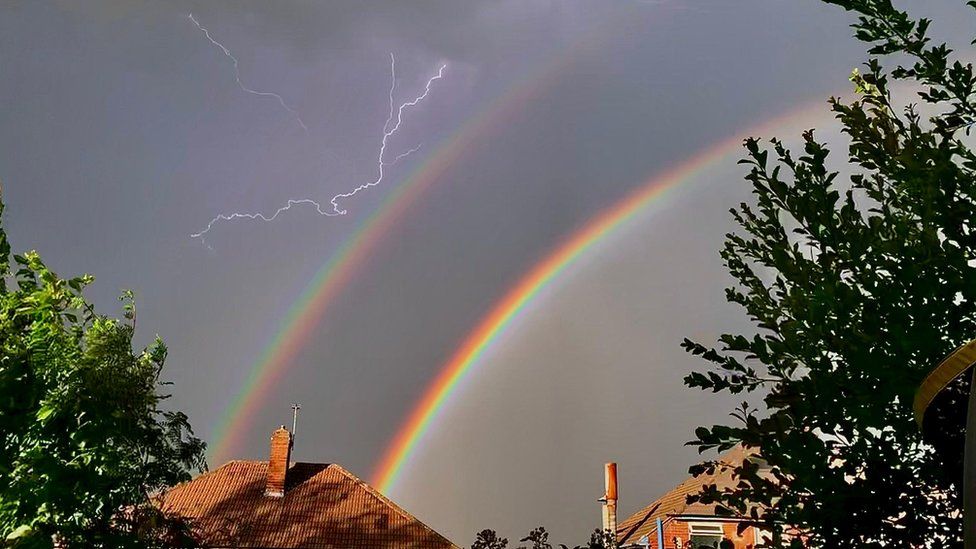 Double rainbow and a lightning strike