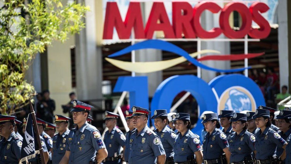 Policemen stand in formation during celebrations to mark his 100th birthday of late dictator Ferdinand Marcos in Batac, Ilocos Norte province, north of Manila on September 10, 2017.