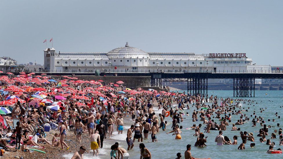 People on the beach in Brighton, East Sussex.