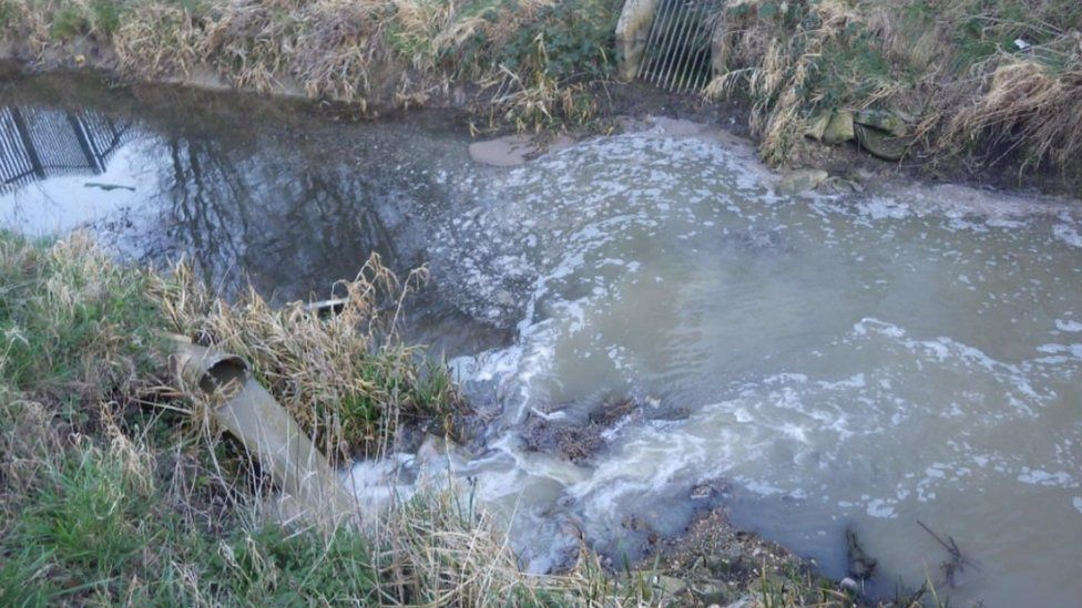 Sewage in river at Yaxley