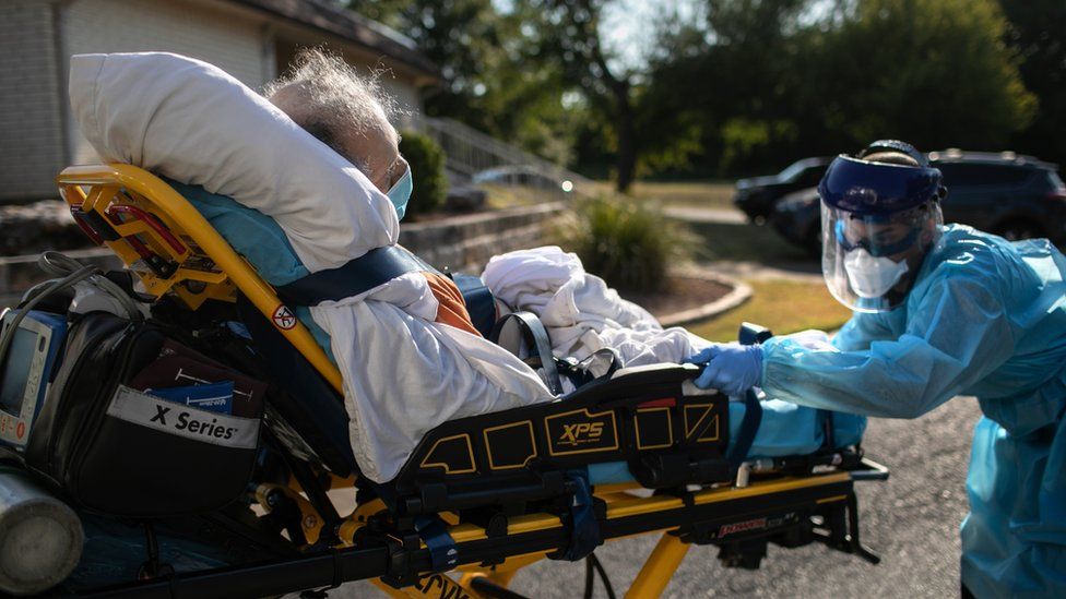 An Austin-Travis County medic loads a patient with COVID-19 symptoms into an ambulance on August 05, 2020 in Austin, Texas