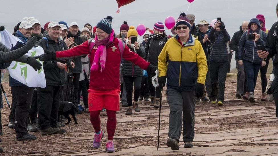 Des Lally approaches the summit with his dad