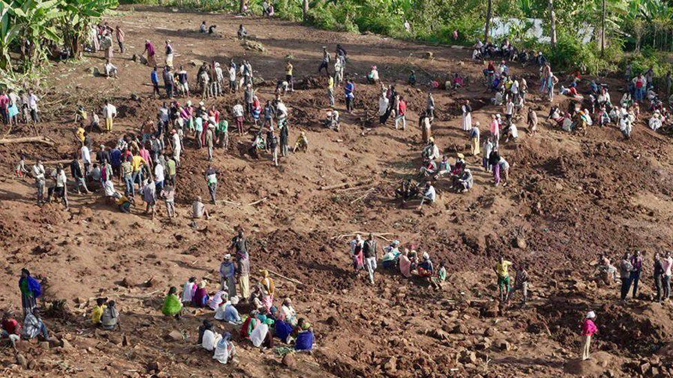 People gathered at the site of the landslides in Gofa zone, Ethiopia - 24 July 2024