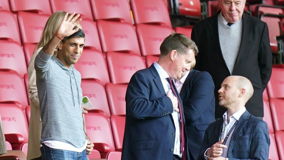 Rishi Sunak waving from the stands at St Mary's