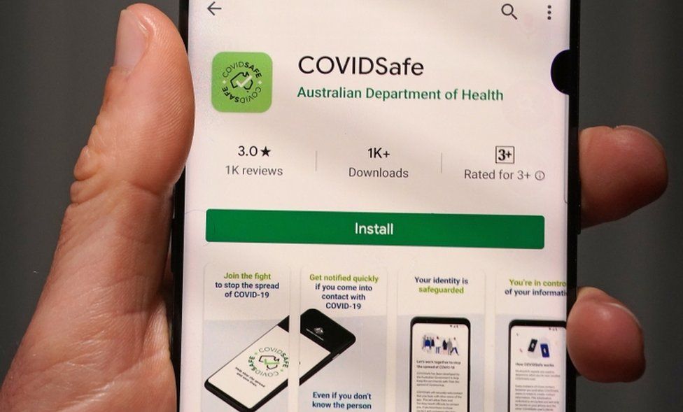 A person displays the Australian government's new voluntary coronavirus tracing app "COVIDSafe" on a mobile phone in Melbourne
