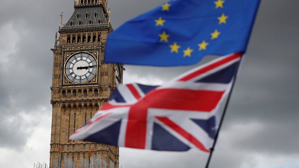 The Union Jack and European Union flags fly near Big Ben